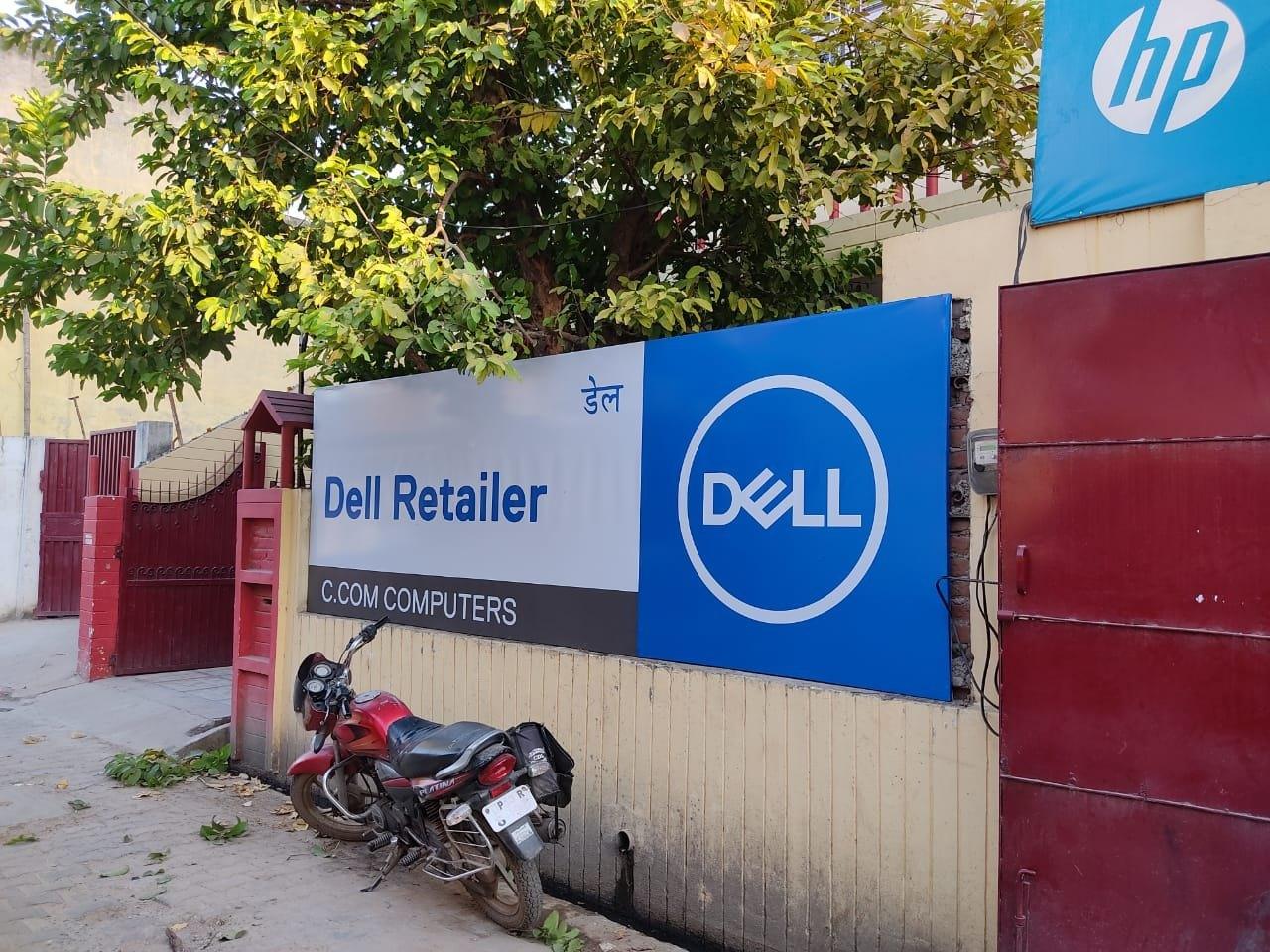 Front-lit flex shop signage on a retail storefront